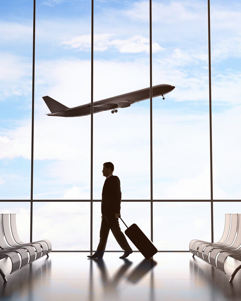 A traveller crossing the airport terminal
